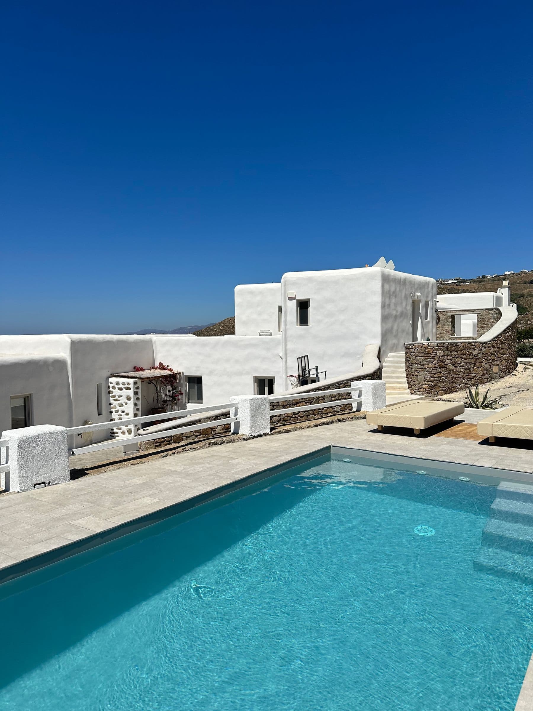 Whitewashed Mediterranean villa above a private pool